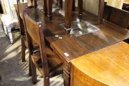 A hardwood table and six chairs