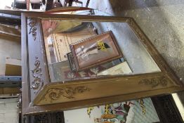 A large gilt framed bevelled mirror and a large circular mirror