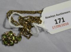 A peridot and seed pearl flower cluster pendant on a 9 ct gold chain