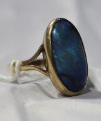 A 9 ct gold large black opal ring