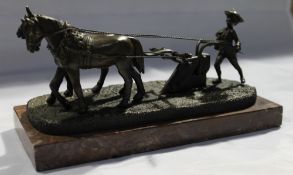 A bronze model of a plough team
