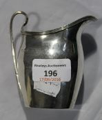 A silver cream jug