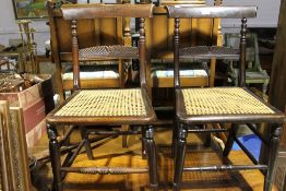 A pair of Regency cane seated chairs