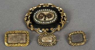 A Victorian yellow metal and black enamel seed pearl set mourning brooch,