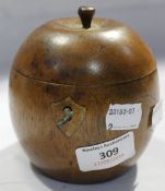 A wooden fruit formed tea caddy