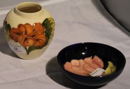 A small white ground Moorcroft vase and bowl