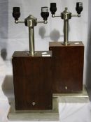 A pair of wooden and chrome lamps