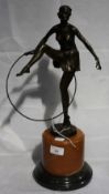A Deco style bronze of a hula hoop girl