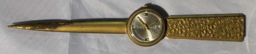 A 1950/1960s novelty brass watch/paperknife