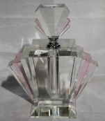 A large pink fan scent bottle