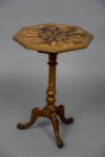 A 19th century specimen wood inlaid octagonal tripod table CONDITION REPORTS: Some