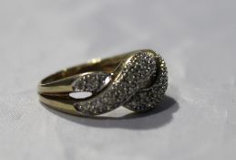 A 9 ct gold cross over dress ring