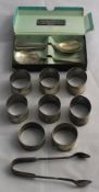 A quantity of silver and other napkin rings etc