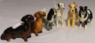 Six Beswick dogs