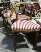 A set of four Victorian mahogany balloon back dining chairs