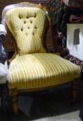 A Victorian walnut framed nursing chair