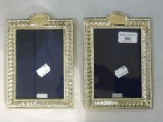 A pair of silver frames