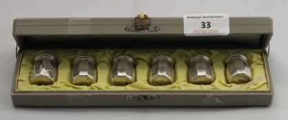 A boxed set of sterling silver peppers