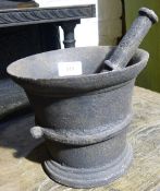 A 19th century cast iron pestle and mortar