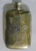 A miniature silver hip flask