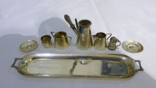 A miniature silver tea set and tray