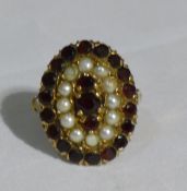 A 9 ct gold garnet and pearl ring