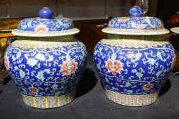 A pair of late 19th century Chinese lidded vases