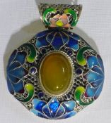 A Chinese silver and amber pendant