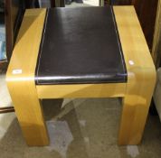 A modern faux leather inset coffee table