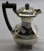 A silver coffee pot