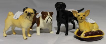 Four Beswick dogs