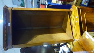 A modern yew wood corner cabinet