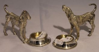 A pair of silver plated dog form salts