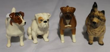 Four Beswick dogs