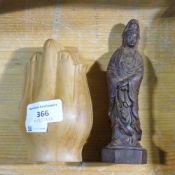 A Chinese wooden figure and hand icon