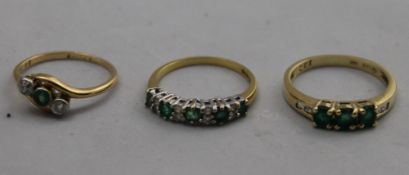 A 14 ct gold, emerald and diamond ring and two other gold,