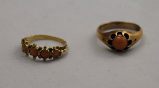 Two gold and coral rings