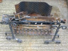 A fire basket and andirons