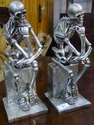 A pair of silvered skeletons