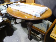 An early 20th century extending oval dining table