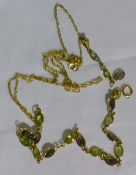 A stone set 9 ct gold chain and a matching bracelet