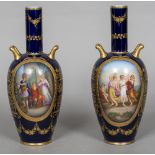 A pair of 19th century blue ground Vienna porcelain vases Each with twin gilt handles and gilt