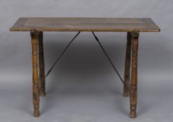 An 18th century Spanish walnut trestle table The cleated rectangular top above the turned legs