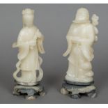 A pair of Chinese carved soapstone figures Worked as a sage and his female companion. 21.5 cm high.