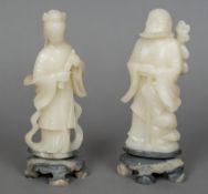 A pair of Chinese carved soapstone figures Worked as a sage and his female companion. 21.5 cm high.