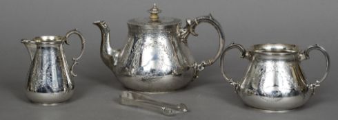 A Victorian silver three piece tea set, the teapot hallmarked London 1870,