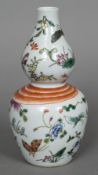 A Chinese porcelain double gourd vase Painted with a tied ribbon and insects,