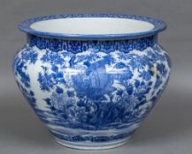 A large Japanese blue and white porcelain jardiniere Decorated with exotic birds in a continuous