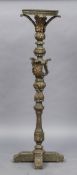 A large 19th century painted wooden pricket stick The crimped metal mounted top above the acanthus