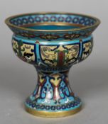 A 19th century Chinese cloisonne tazza The flared rim above the stylised face lappets,